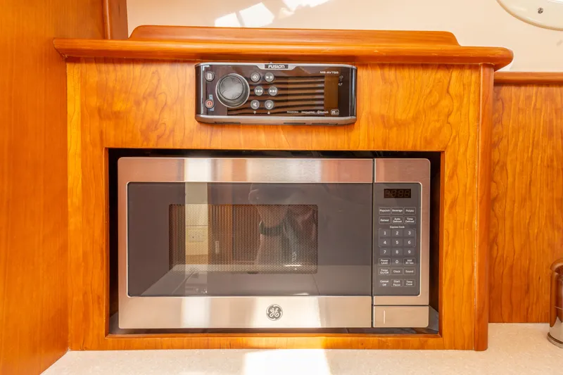 Just B Yacht Photos Pics Microwave and stereo system in 2018 Hinckley Picnic Boat MKII interior.