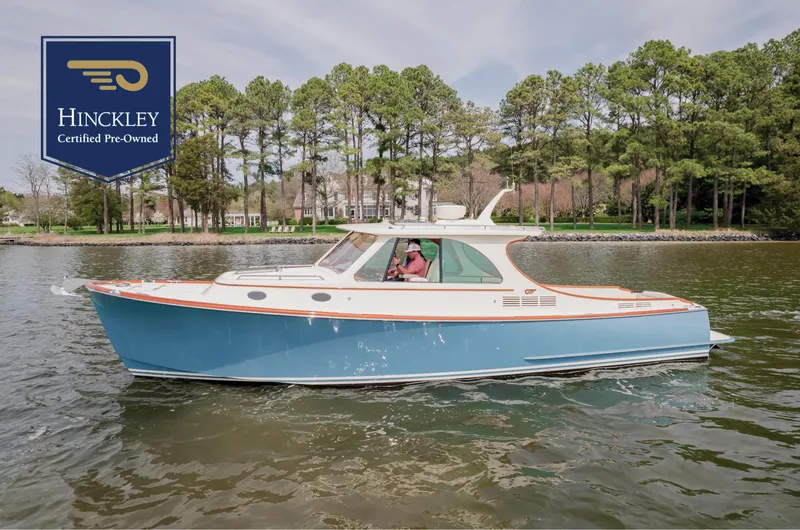 Just B Yacht Photos Pics Hinckley Picnic Boat MKII 2018 cruising on a lake, certified pre-owned.