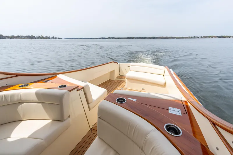Just B Yacht Photos Pics 2018 Hinckley Picnic Boat MKII cruising on calm waters, featuring luxurious seating and wooden accents.