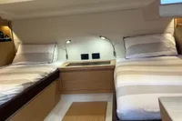 Interior of 2020 Pardo Yachts 43, featuring twin beds and modern wooden design.