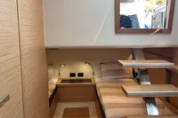 Interior of 2020 Pardo Yachts 43, featuring modern wood finishes and twin beds.