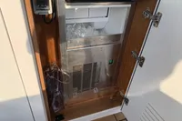 Ice maker on 2020 Pardo Yachts 43, open cabinet with ice inside.