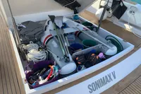 Storage compartment on 2020 Pardo Yachts 43, filled with boating equipment and accessories.
