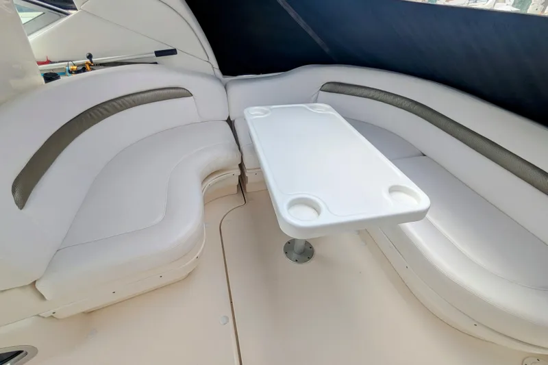  Yacht Photos Pics 2004 Sea Ray 340 Sundancer interior with white seating and table.