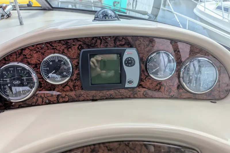  Yacht Photos Pics Dashboard of 2004 Sea Ray 340 Sundancer with gauges and navigation display.