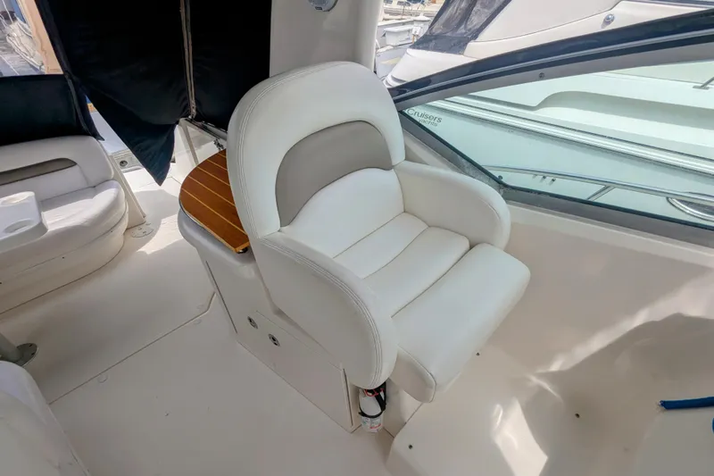  Yacht Photos Pics Luxury seating on 2004 Sea Ray 340 Sundancer yacht, featuring white leather upholstery.