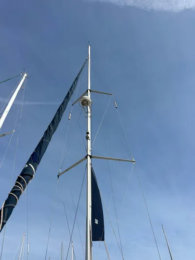  Yacht Photos Pics Sailboat mast of a 2008 Hunter 38 against a clear blue sky.