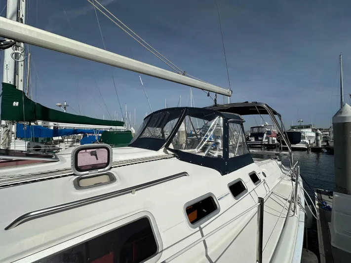  Yacht Photos Pics 2008 Hunter 38 sailboat docked at marina, featuring sleek design and spacious deck.