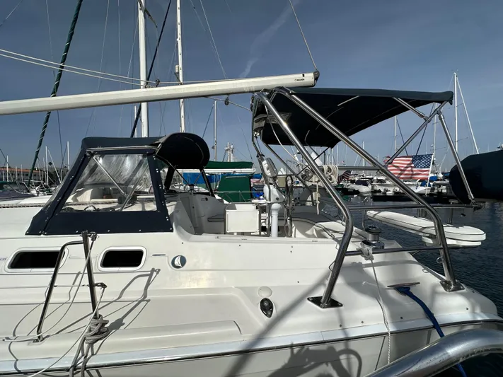  Yacht Photos Pics 2008 Hunter 38 sailboat docked in marina, featuring sleek design and canopy.