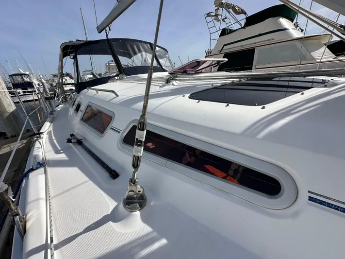  Yacht Photos Pics 2008 Hunter 38 sailboat docked at marina, showcasing sleek white deck design.