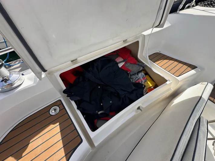  Yacht Photos Pics Storage compartment on a 2008 Hunter 38 sailboat, containing clothes and gear.