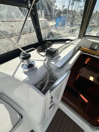  Yacht Photos Pics 2008 Hunter 38 sailboat cockpit with winch, ropes, and navigation equipment.