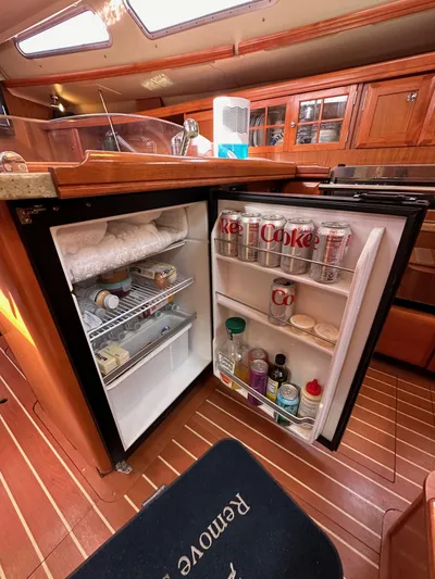  Yacht Photos Pics Small fridge inside 2008 Hunter 38 yacht, stocked with drinks and condiments.