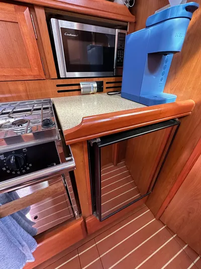  Yacht Photos Pics Compact kitchen in 2008 Hunter 38 yacht with microwave, stove, and coffee maker.