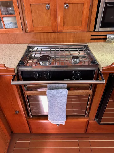  Yacht Photos Pics Wooden yacht kitchen with stove and oven, Hunter 38, 2008 model.