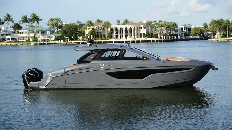 Lazy Blum Yacht Photos Pics 2023 Cruisers Yachts 42 GLS OB on serene water, luxury boat with sleek design.