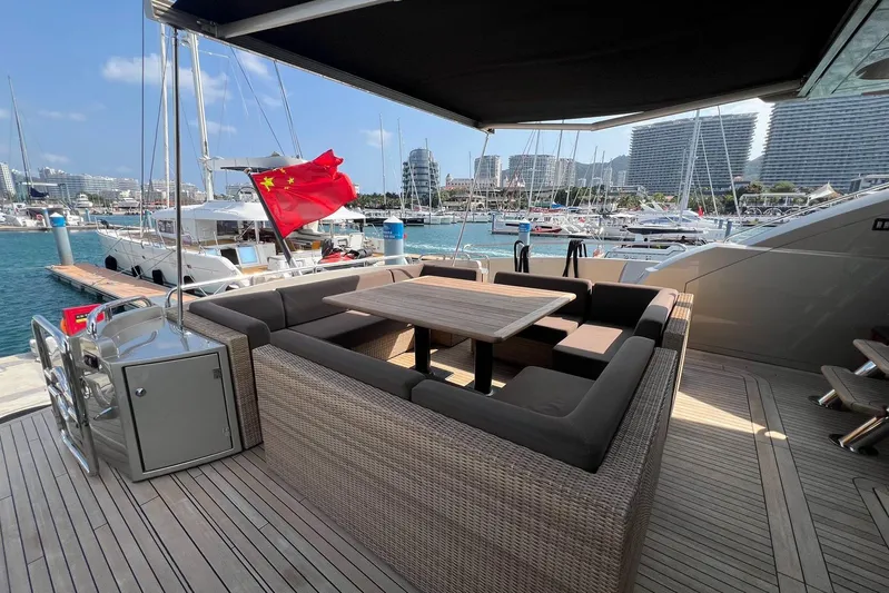  Yacht Photos Pics Luxury Sunseeker Predator 108 yacht deck with seating, docked in a marina, 2010 model.