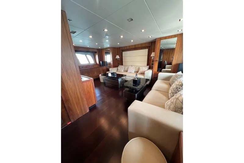  Yacht Photos Pics Luxurious interior of 2010 Sunseeker Predator 108 yacht with elegant wood and plush seating.