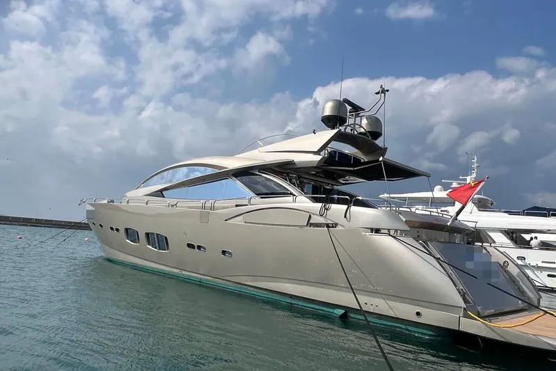  Yacht Photos Pics Luxurious 2010 Sunseeker Predator 108 yacht docked under a partly cloudy sky.