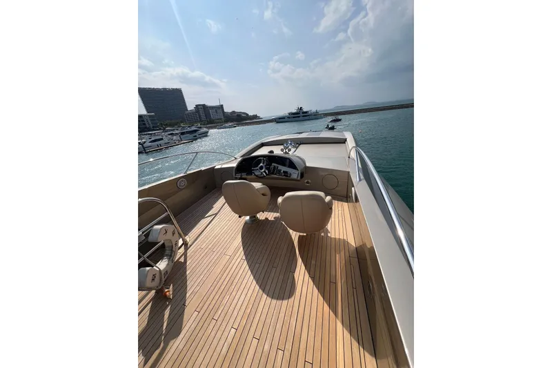  Yacht Photos Pics Luxurious 2010 Sunseeker Predator 108 yacht with sleek deck and marina view.