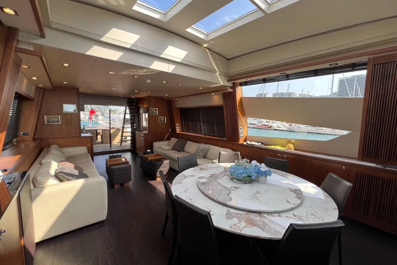  Yacht Photos Pics Luxurious interior of 2010 Sunseeker Predator 108 yacht with elegant seating and dining area.