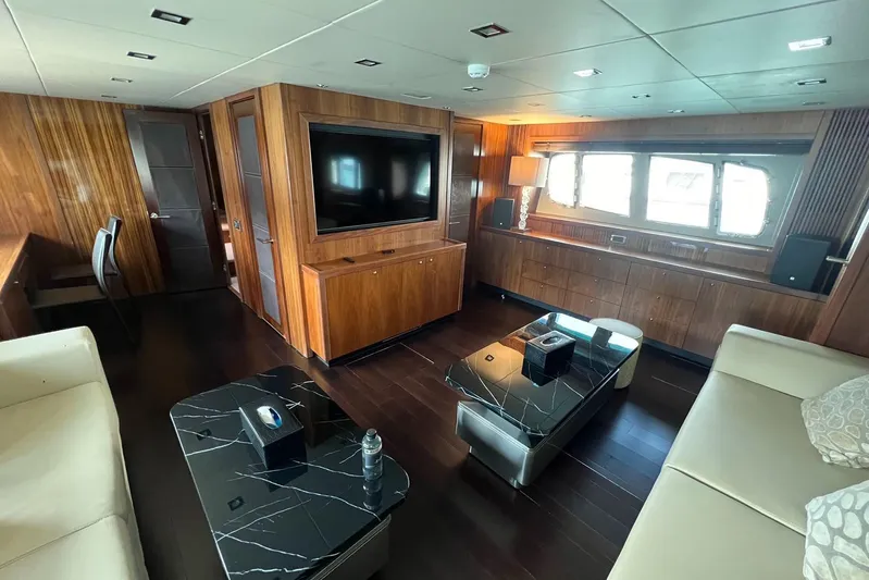  Yacht Photos Pics Luxurious interior of 2010 Sunseeker Predator 108 yacht with elegant wood paneling.