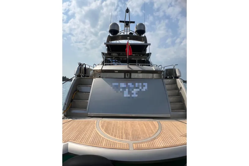  Yacht Photos Pics Luxury Sunseeker Predator 108 yacht, 2010 model, rear view with sleek design and wooden deck.