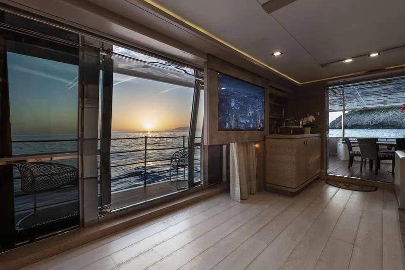  Yacht Photos Pics Luxurious interior of 2013 Custom Line Navetta 33 Crescendo yacht with ocean sunset view.