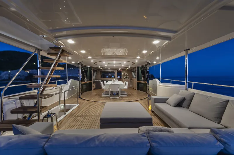  Yacht Photos Pics Luxurious 2013 Custom Line Navetta 33 Crescendo yacht interior with elegant seating and dining area.