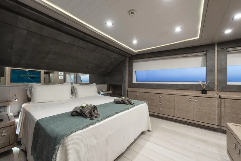  Yacht Photos Pics Luxurious bedroom interior on 2013 Custom Line Navetta 33 Crescendo yacht, featuring elegant design.