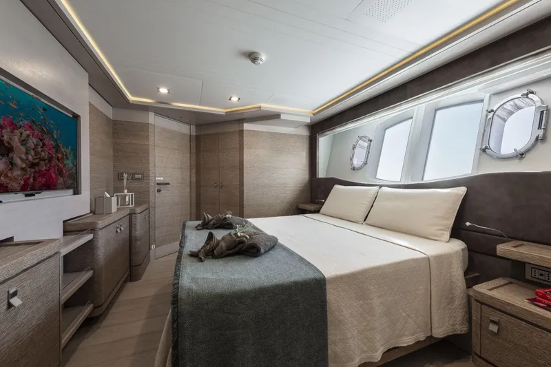  Yacht Photos Pics Luxurious bedroom interior of 2013 Custom Line Navetta 33 Crescendo yacht with modern decor.