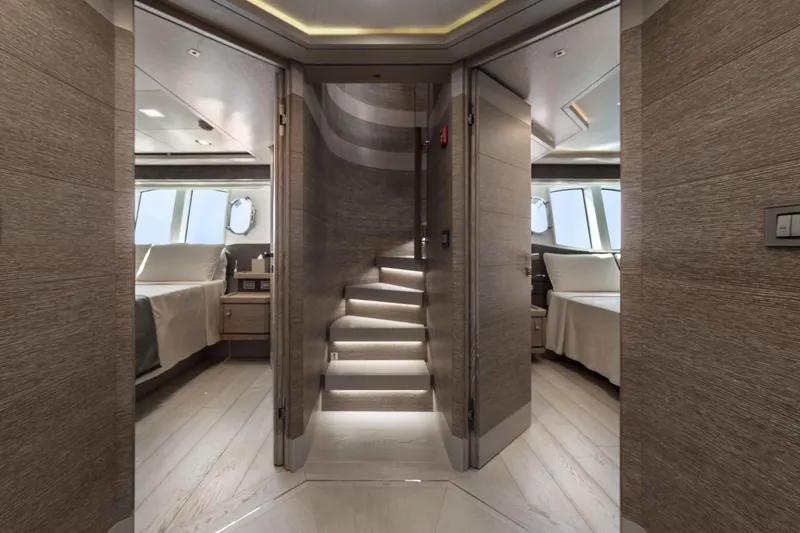  Yacht Photos Pics Luxurious interior of 2013 Custom Line Navetta 33 Crescendo yacht with elegant staircase and bedrooms.