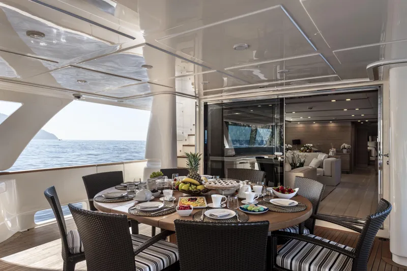  Yacht Photos Pics Luxurious dining area on 2013 Custom Line Navetta 33 Crescendo yacht with ocean view.