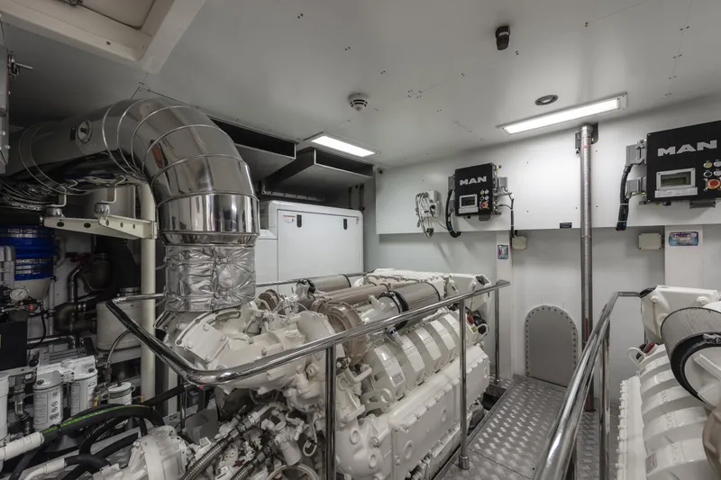  Yacht Photos Pics Engine room of 2013 Custom Line Navetta 33 Crescendo yacht, featuring MAN engines and modern equipment.