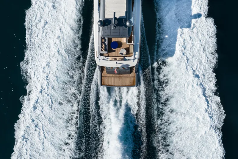 Mad Day Yacht Photos Pics Aerial view of 2018 Canados 888 Evolution yacht cruising on open water.