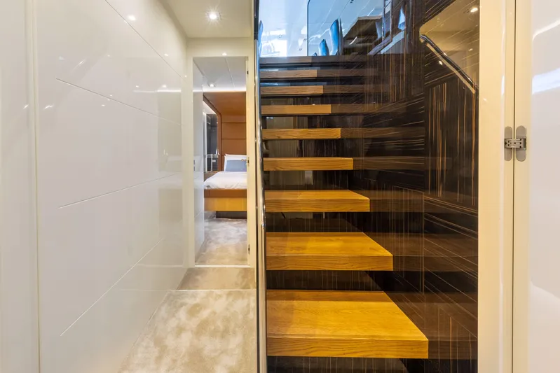 Mad Day Yacht Photos Pics Interior of 2018 Canados 888 Evolution yacht with modern staircase and bedroom view.