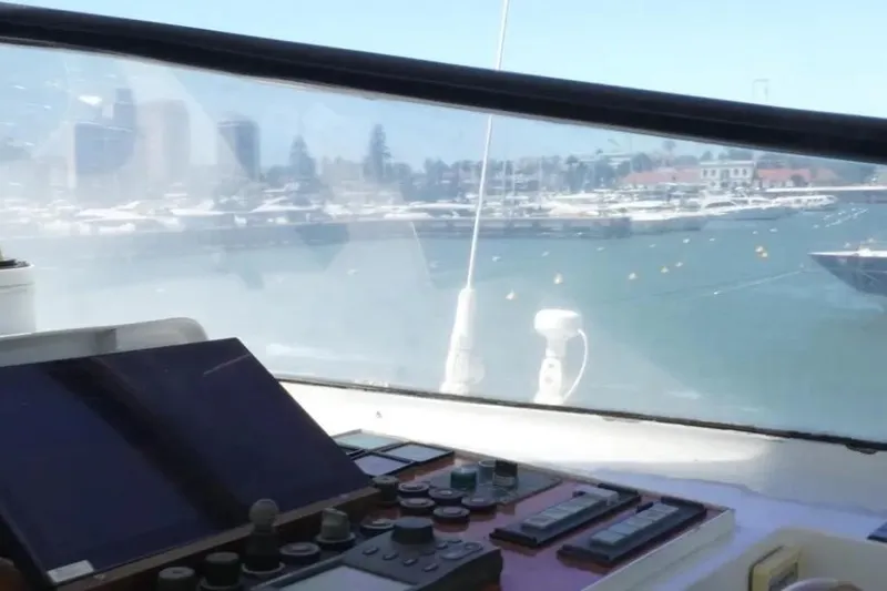  Yacht Photos Pics Cockpit view from 1987 Lurssen 110 yacht overlooking marina with control panel.