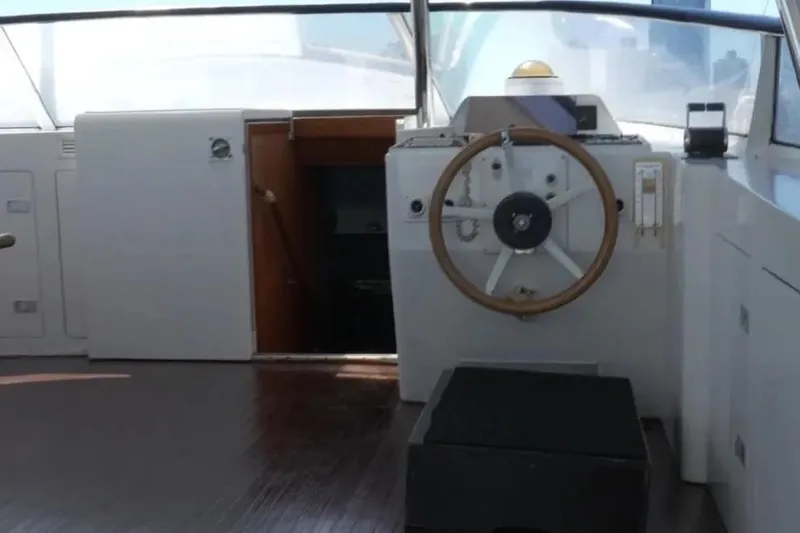  Yacht Photos Pics Interior view of 1987 Lurssen 110 yacht helm with wooden steering wheel.