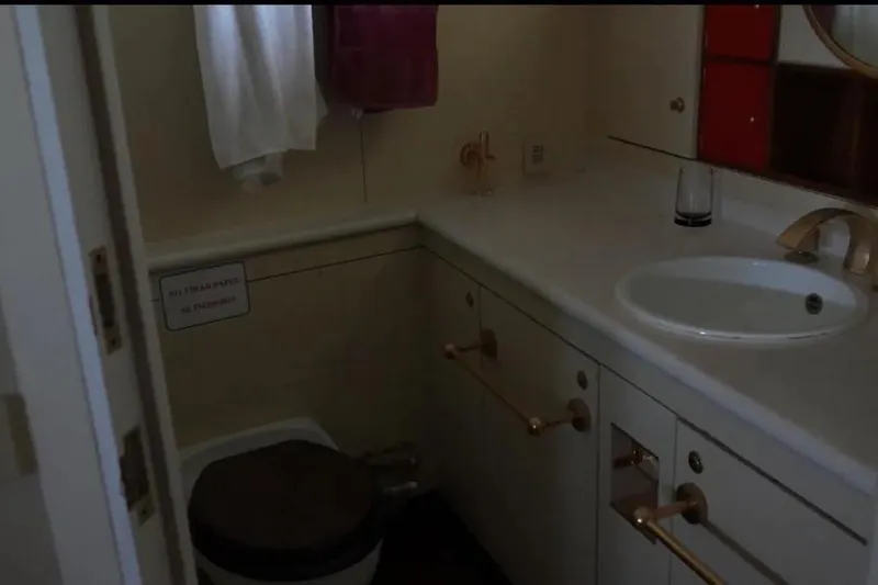  Yacht Photos Pics Bathroom interior of 1987 Lurssen 110 yacht with sink and toilet.