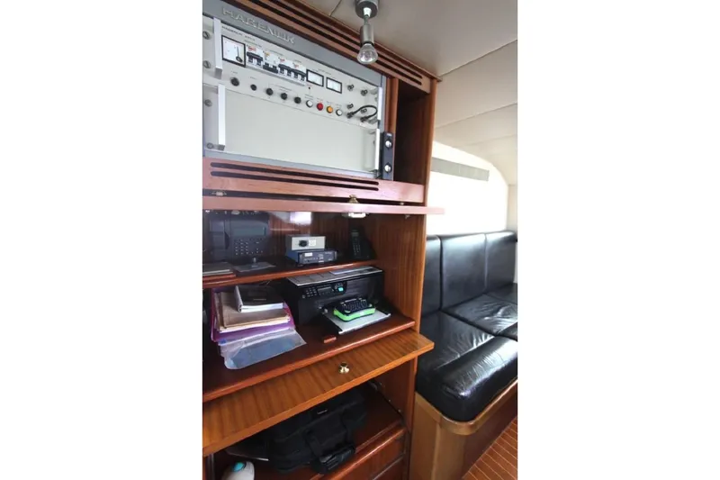  Yacht Photos Pics Interior of 1987 Lurssen 110 yacht with control panel and seating area.