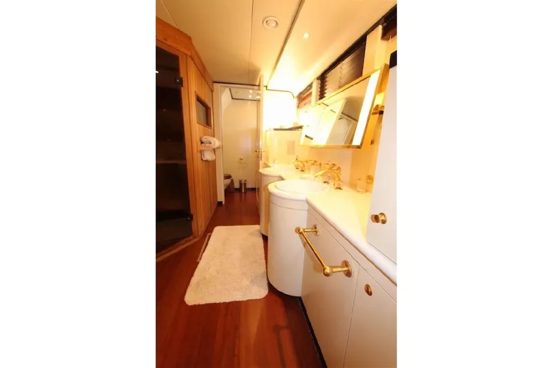  Yacht Photos Pics Luxurious bathroom interior on 1987 Lurssen 110 yacht, featuring elegant fixtures and wooden accents.