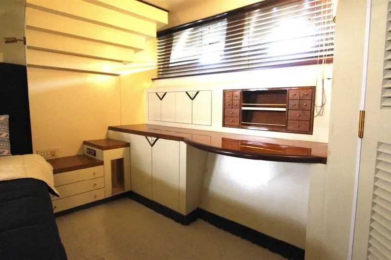  Yacht Photos Pics Interior of 1987 Lurssen 110 yacht with built-in cabinets and desk.