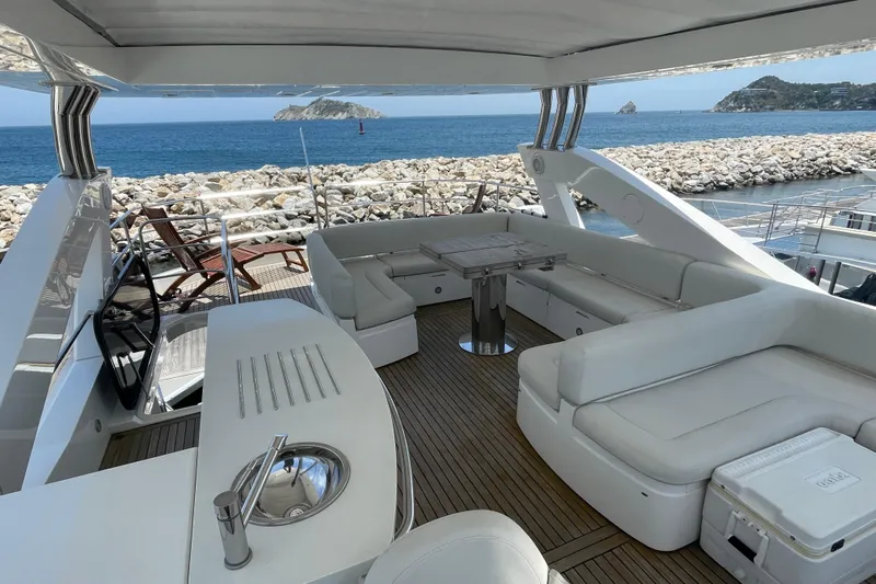 Sea C Yacht Photos Pics Luxurious 2012 Sunseeker 73 yacht deck with elegant seating and ocean view.