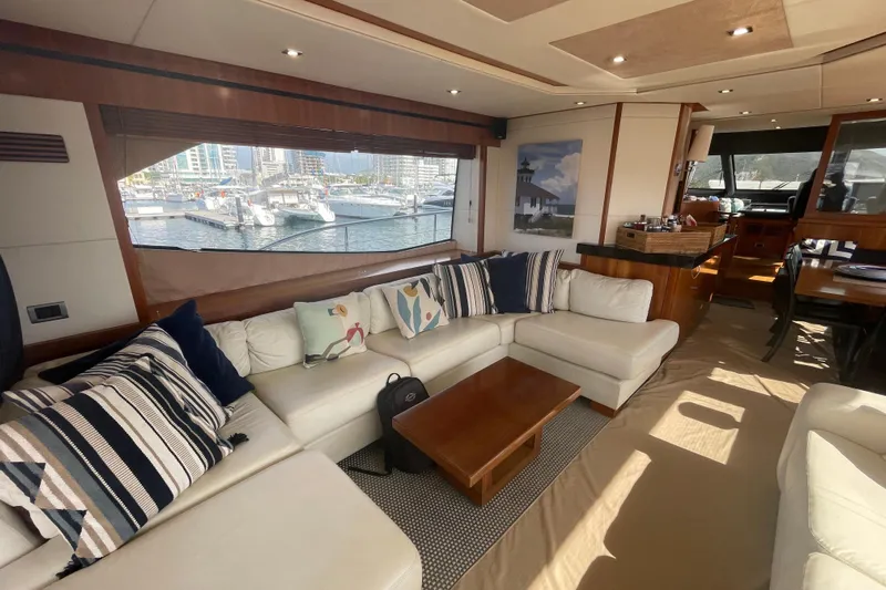 Sea C Yacht Photos Pics Luxurious interior of a 2012 Sunseeker 73 yacht with elegant seating and marina view.