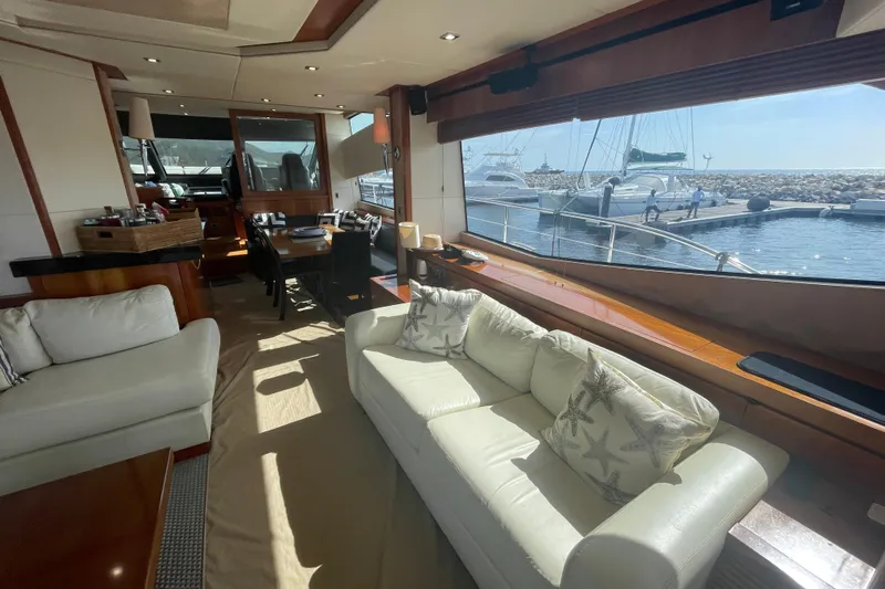 Sea C Yacht Photos Pics Luxurious Sunseeker 73 yacht interior, featuring elegant seating and marina view, 2012 model.