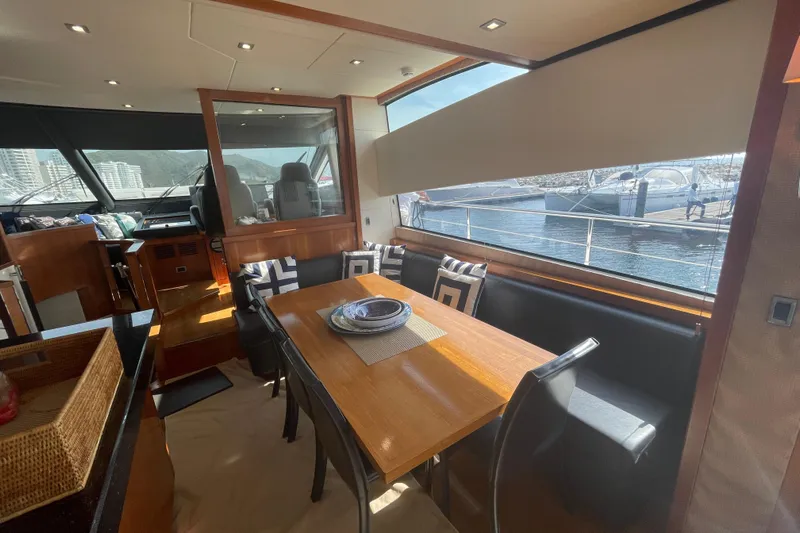 Sea C Yacht Photos Pics Luxurious interior of 2012 Sunseeker 73 yacht with dining area and marina view.