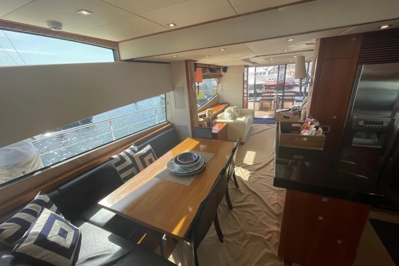 Sea C Yacht Photos Pics Luxurious interior of a 2012 Sunseeker 73 yacht with elegant dining area and waterfront view.