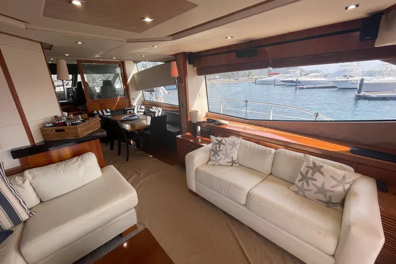 Sea C Yacht Photos Pics Luxurious interior of 2012 Sunseeker 73 yacht with elegant seating and marina view.