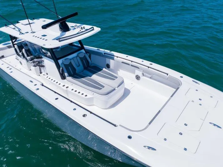  Yacht Photos Pics 2025 Invincible 46 Catamaran on water, showcasing sleek design and spacious deck.