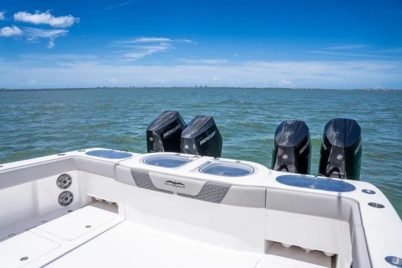  Yacht Photos Pics 2025 Invincible 46 Catamaran with four Mercury engines on open water.